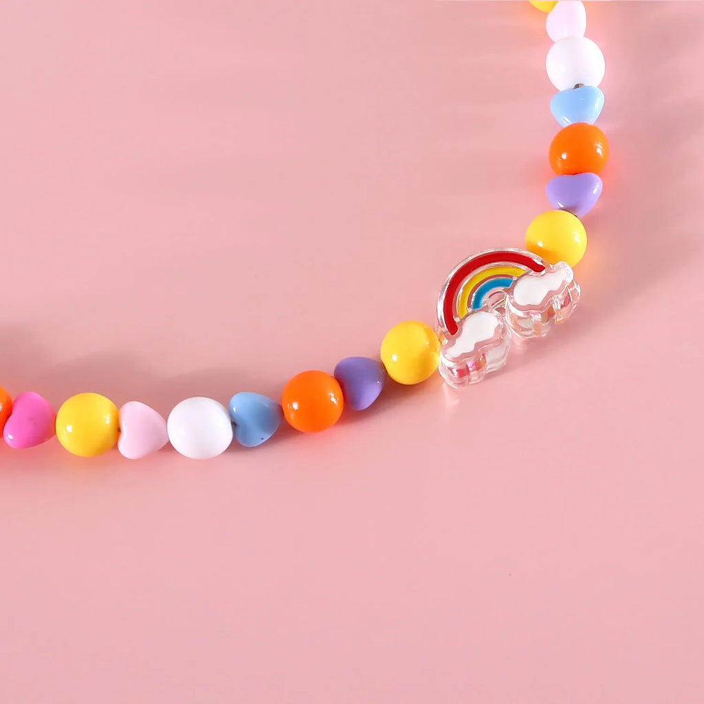 Colourful plastic pearl pet necklace for cats with adjustable sizing in rainbow, peach, and small flower patterns