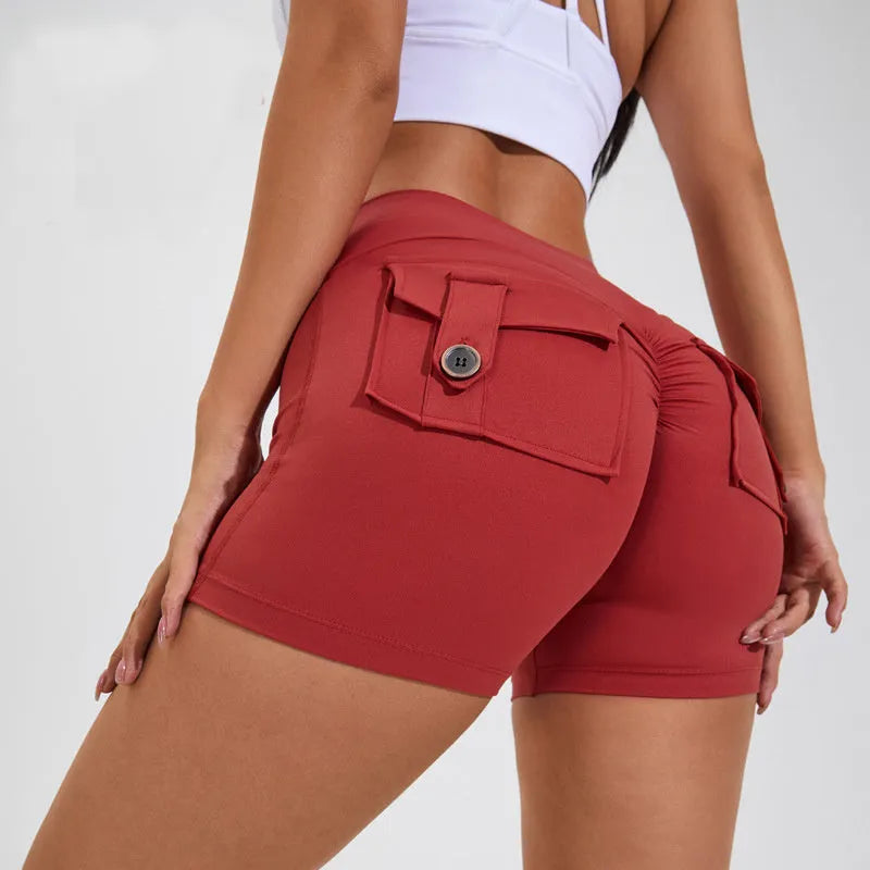 Women's high waist sport shorts in avocado green, side view showing pocket detail.
