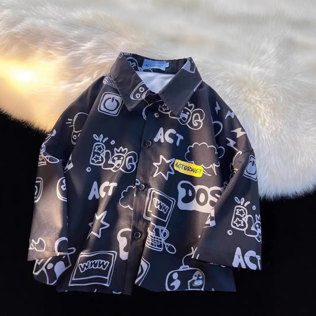 Student loose fit casual shirt with cartoon animation video game graffiti print in white or dark blue, sizes S to 2XL.