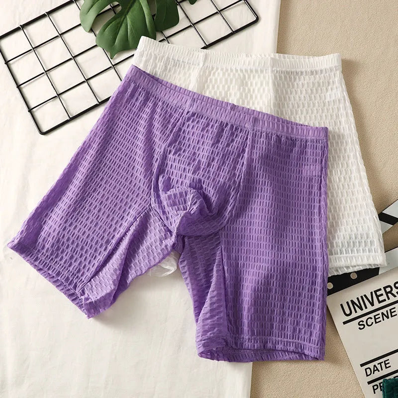 Men's lace boxer briefs in black on a white background, showing the lengthened hip design.