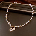 Gold plated clavicle chain necklace with round zircon and imitation pearl pendant