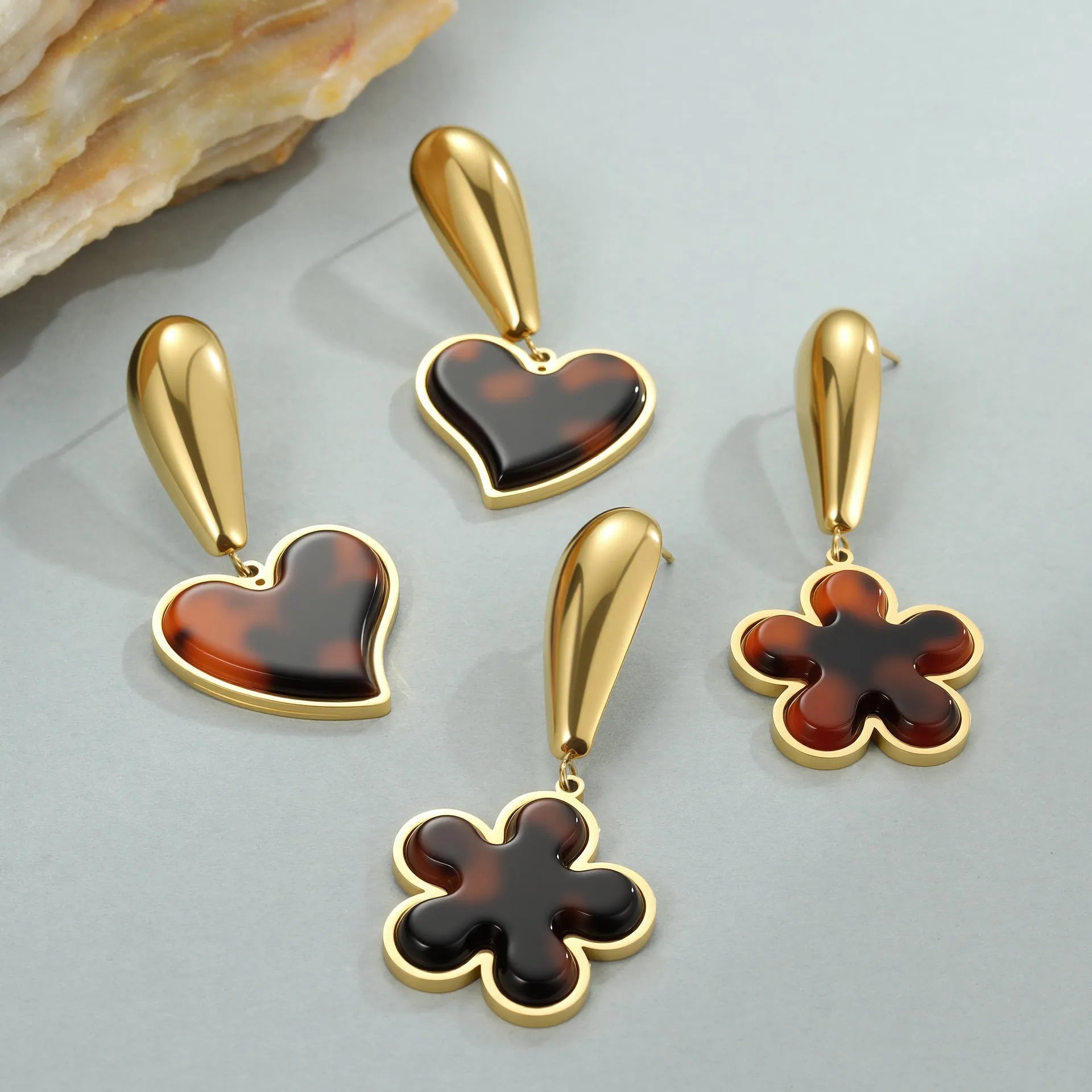 Pair of 18K gold plated stainless steel earrings featuring tortoiseshell resin in heart and flower geometric shapes for women