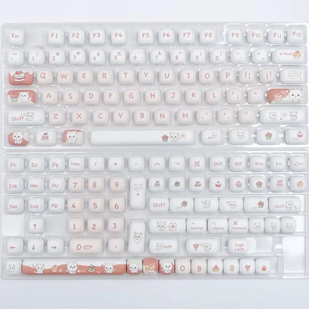 A single round MOG profile key cap with a sublimation printed cartoon dessert cat illustration.