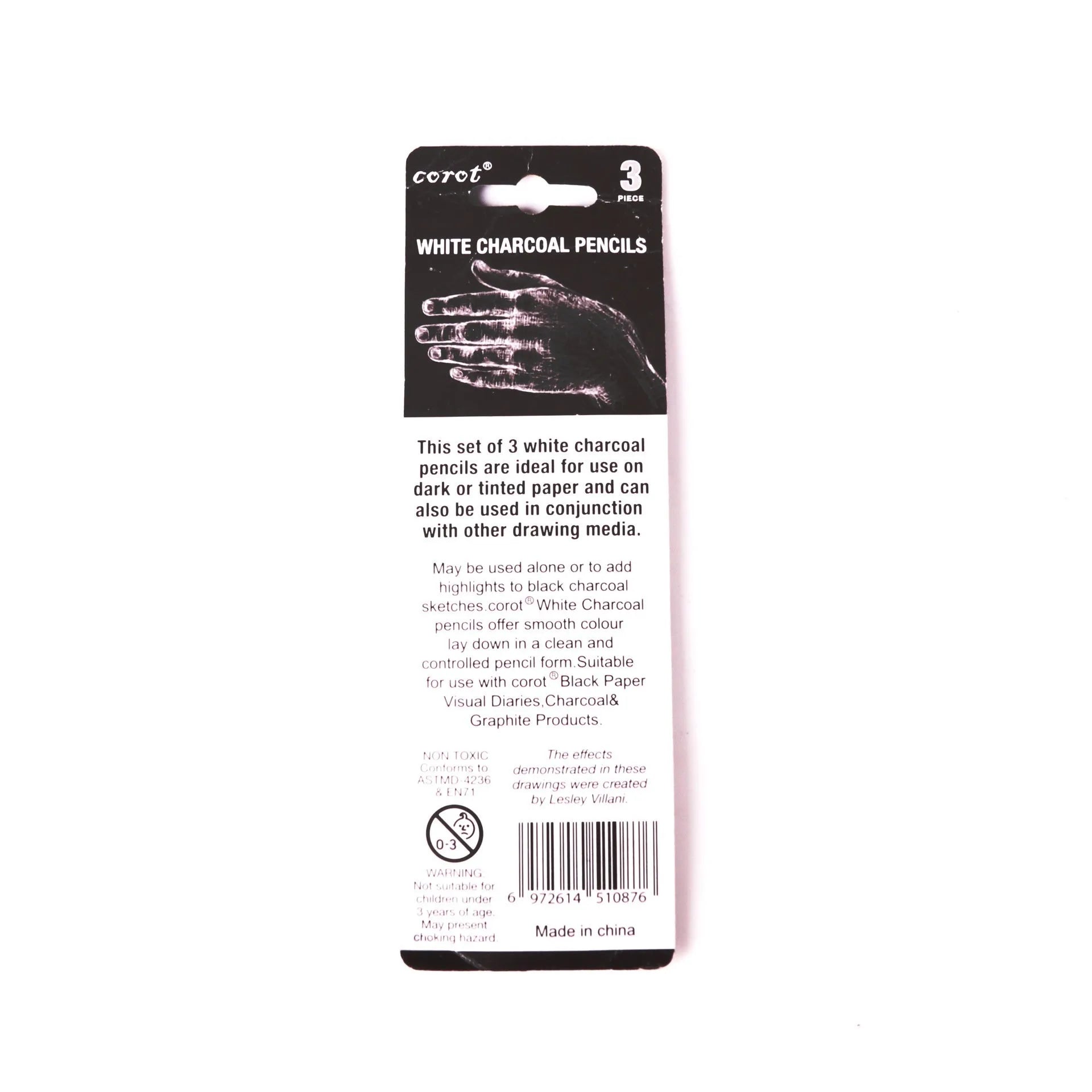 Three white charcoal drawing pencils with wooden barrels for sketching and highlighting