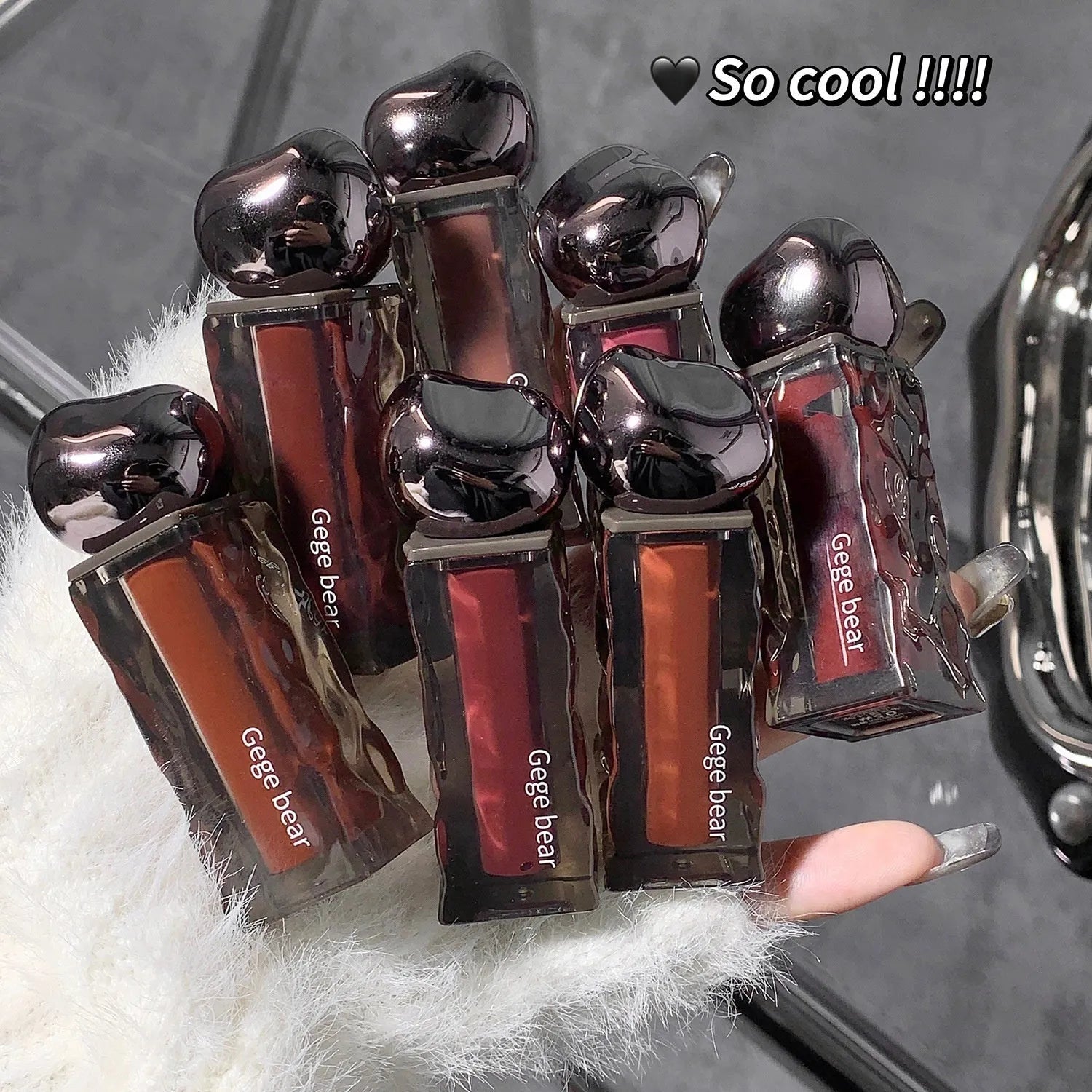 Glacier Lava Lip Lacquer tube with mirror, shown in one of seven colour options.