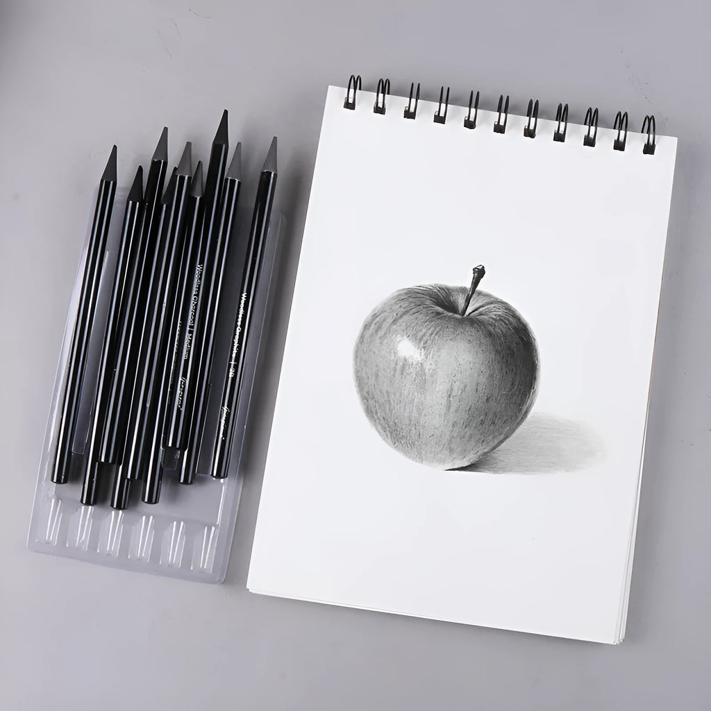 Carbonised pencil suit showing six graphite and three carbonised wooden pencils on suction card packaging