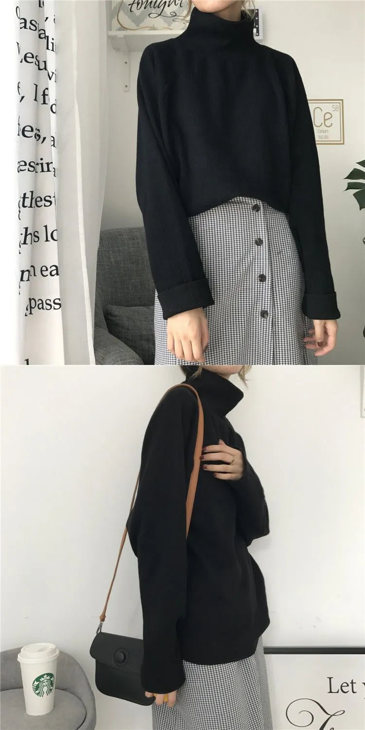 Women's loose fit solid colour long sleeve top with a half-high neck, shown in white.