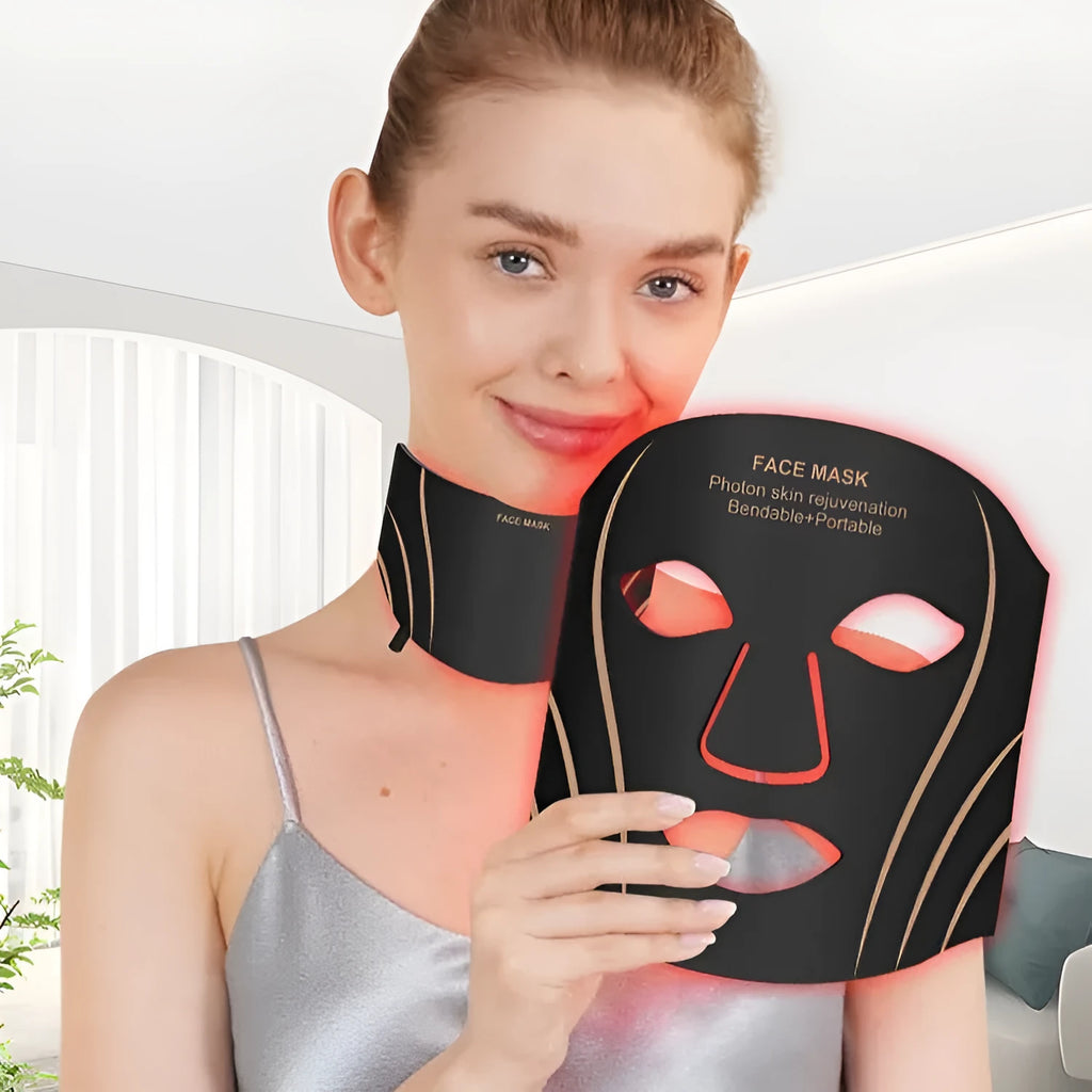 Black and gold IPL LED facial beauty mask device with headband on a white background.