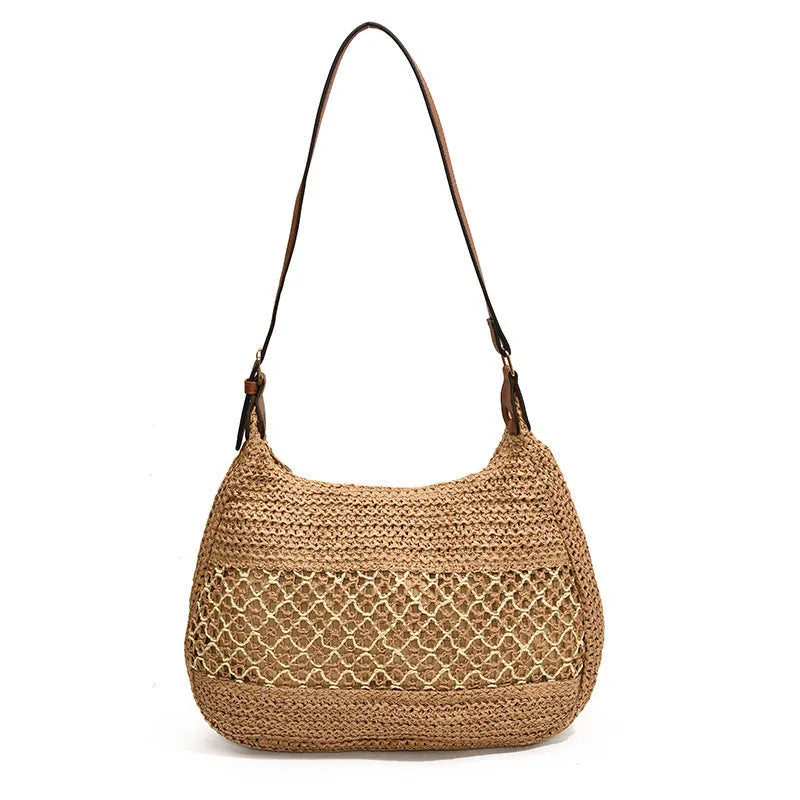 Women's straw cross body bag in khaki colour showing horizontal square shape and woven texture