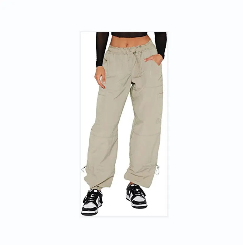 Man wearing loose-fit khaki coloured cargo pants with multiple pockets, straight leg design.