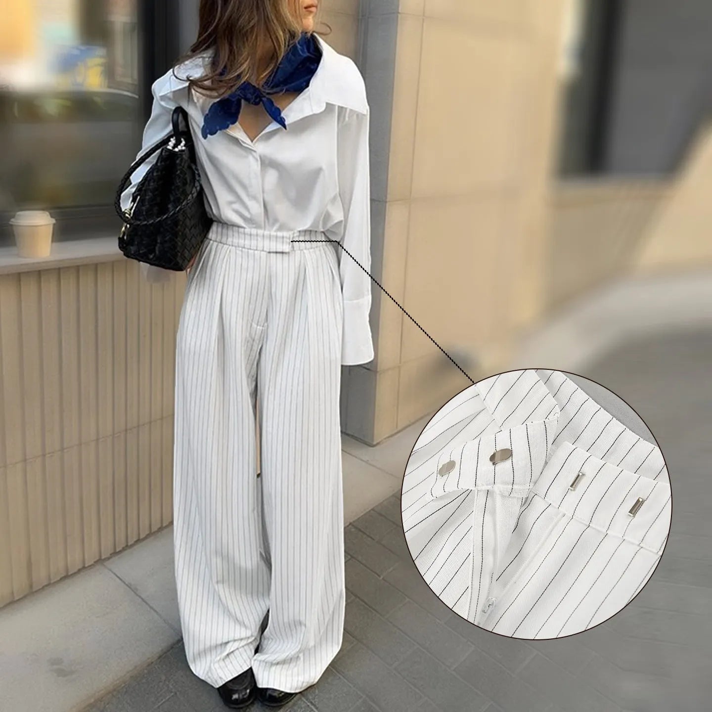 White striped wide-leg commuting trousers with zipper detailing on hanger