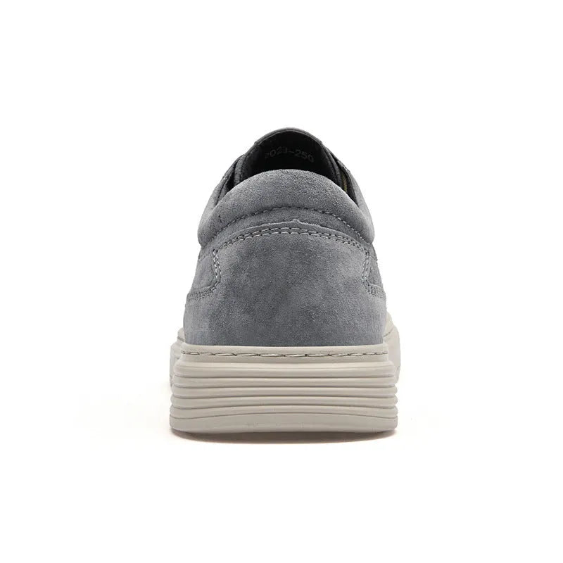 Men's grey casual leather skate shoes with round toe and lace-up front on a rubber sole.