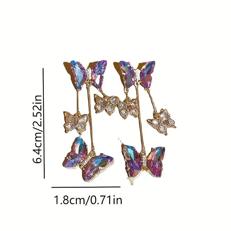 Blue purple butterfly tassel earrings with silver crystal flowers on alloy settings.