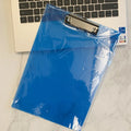 Transparent A4 plate writing board pad with a silver metal flat clip, shown in a blue colour option.