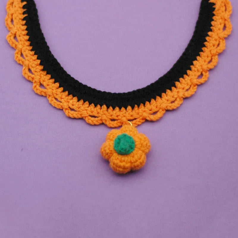 Hand-crocheted wool pet collar with pumpkin design in adjustable sizes for Halloween costumes