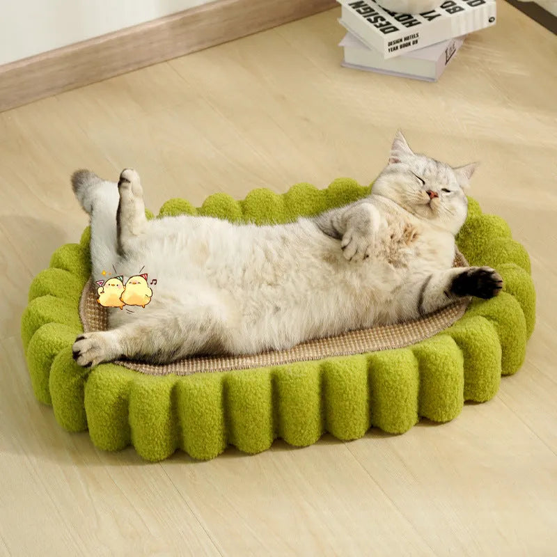 Green oval sisal cat scratching pad and lounge bed measuring 65cm long.