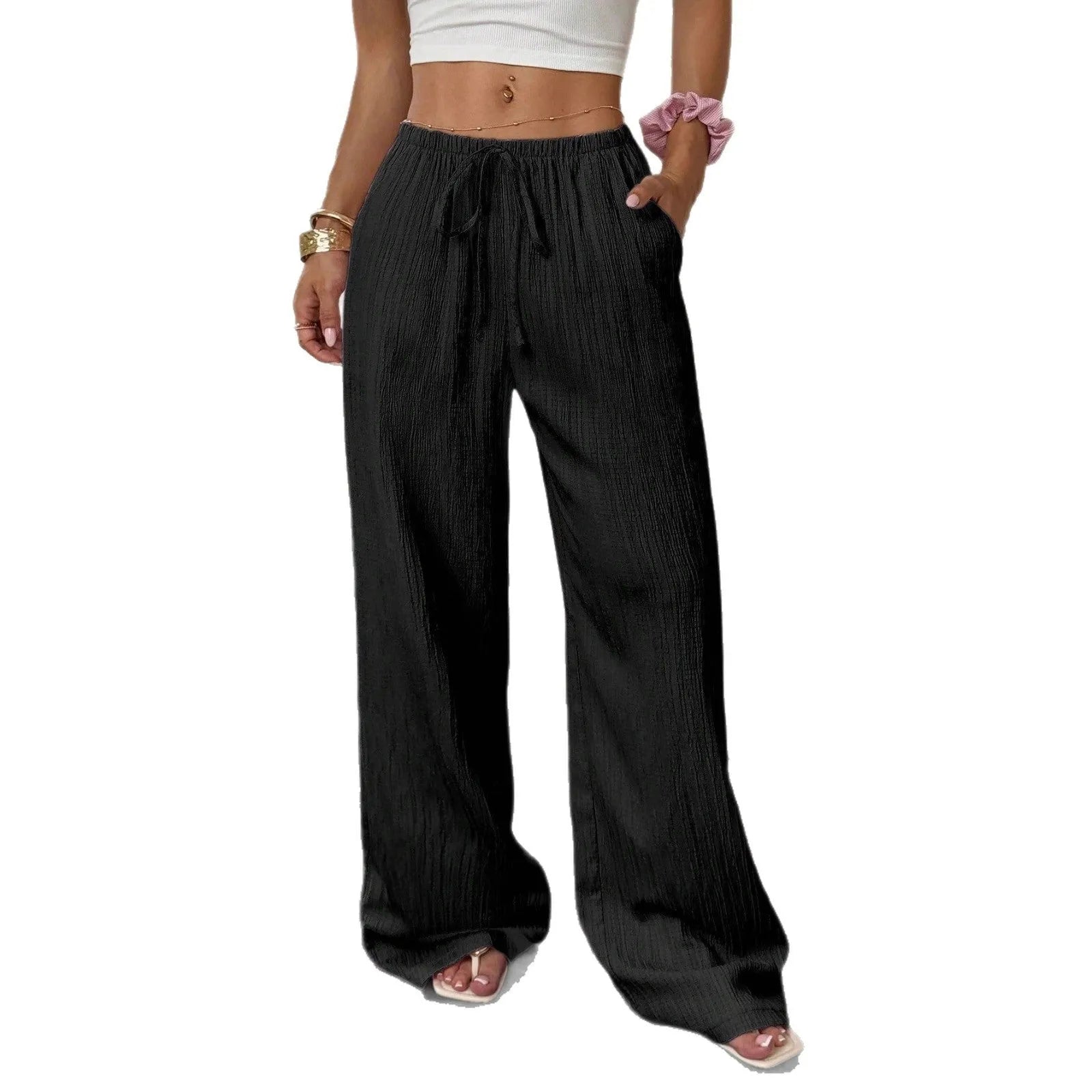 Women's black wide leg trousers with lace-up waist trimming detail on mannequin