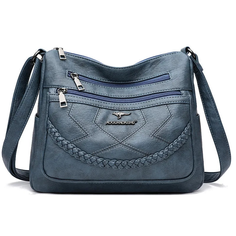 Soft PU leather crossbody shoulder bag in a horizontal square shape, shown in one of four colours: black, blue, red, or yellow.