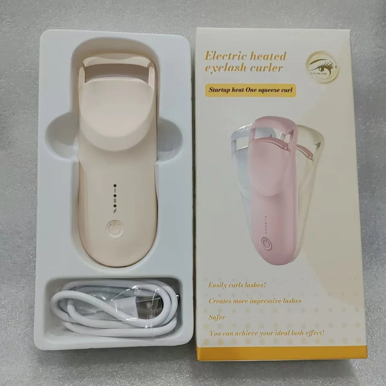 Electric heating eyelash curler with ceramic element in vanilla apricot colour with LED indicator light