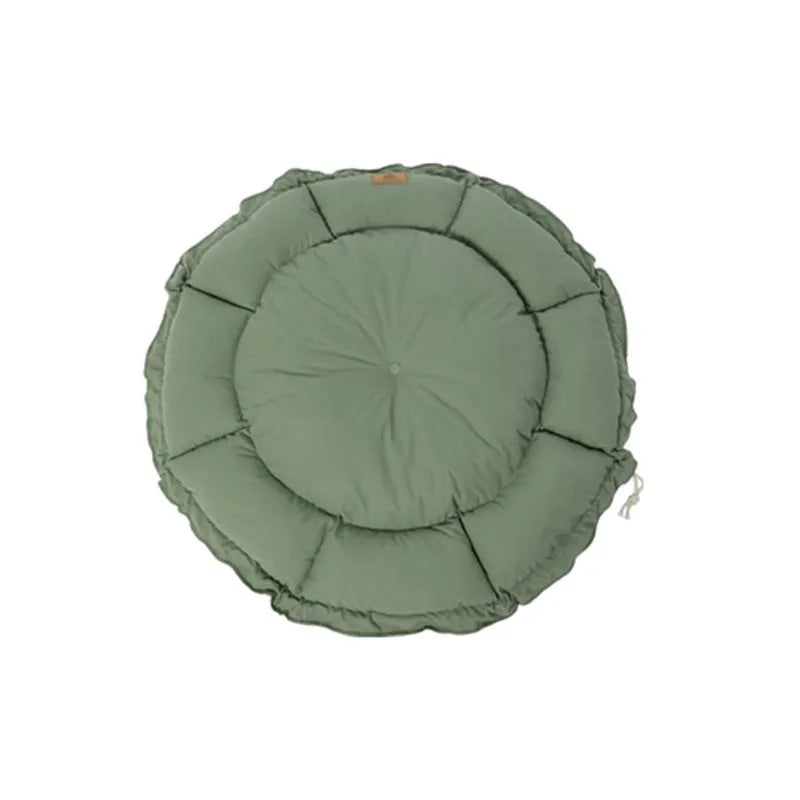Grey reversible donut-shaped pet bed for cats and small dogs on a floor.