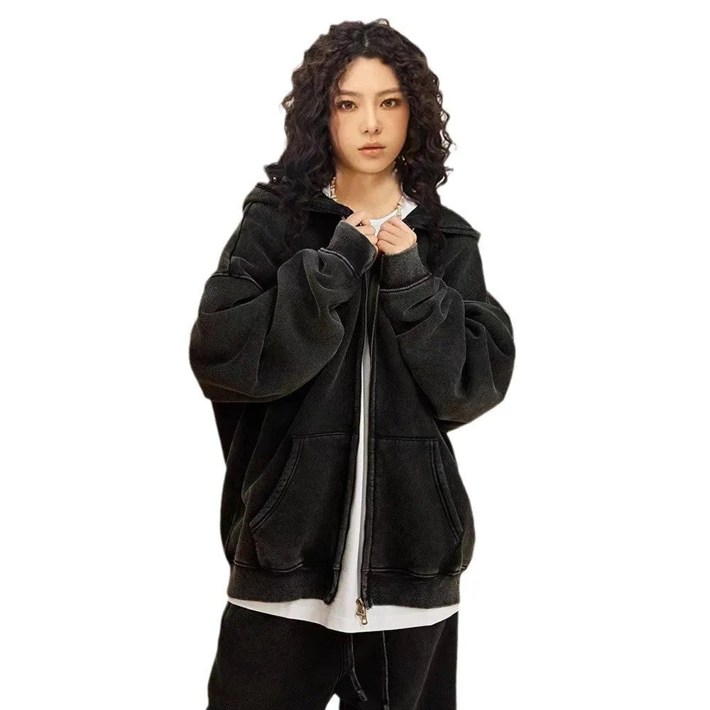 Man wearing a dark green hooded zip-up cardigan with a fleece lining and long sleeves.