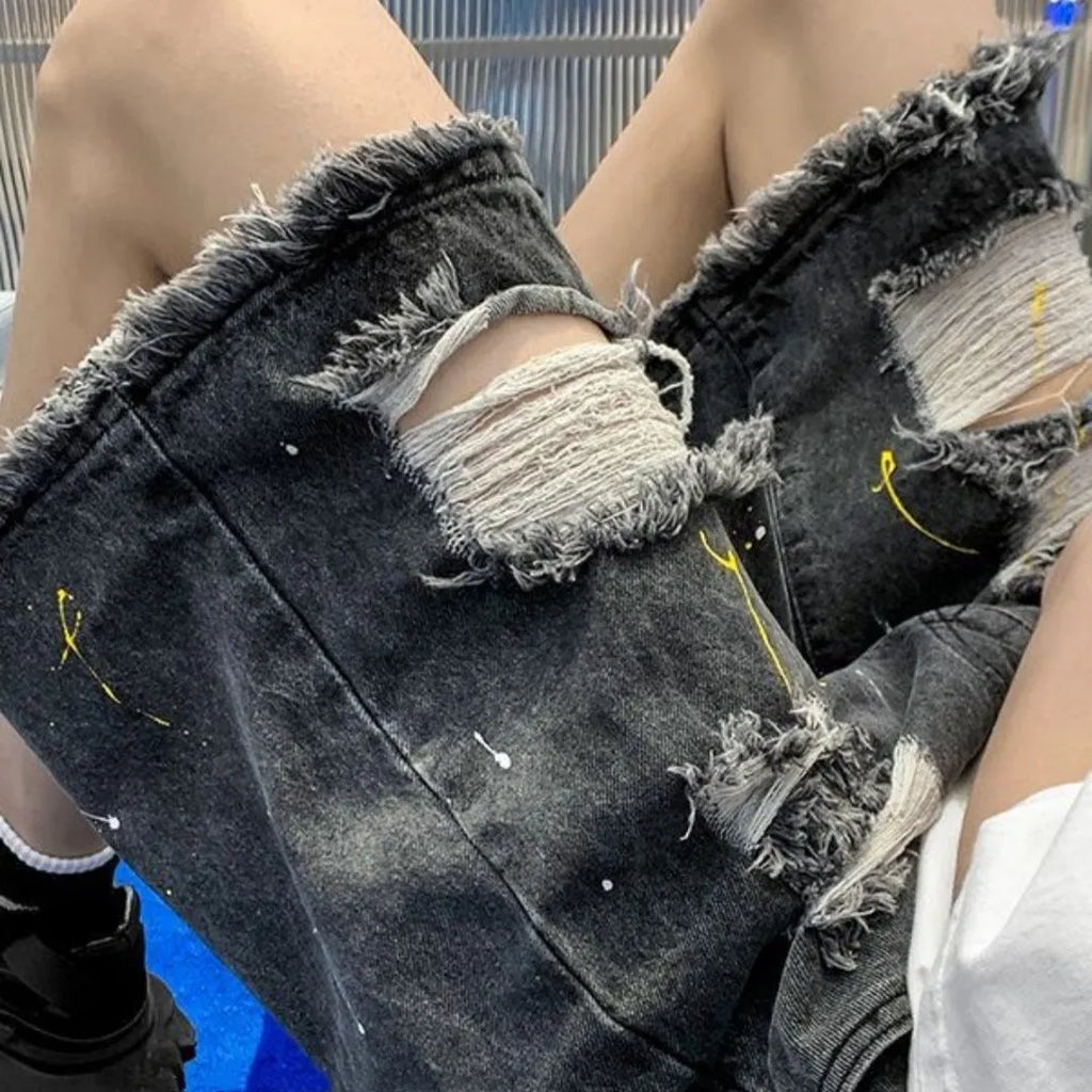 Men's water washed hole denim shorts in black and light blue colours showing loose street style fit