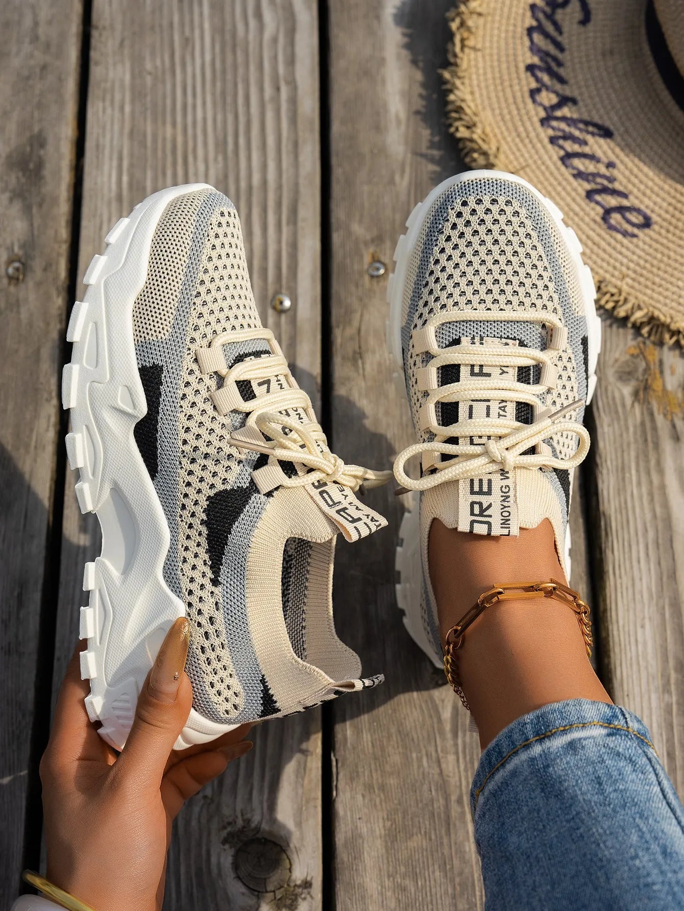 Women's flyknit mesh sneakers with rubber sole and lace-up design in black and gray