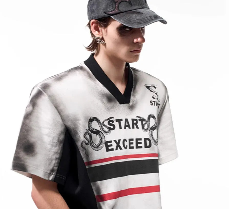 Korean-style women's V-neck short sleeve top with padded shoulders and a black and white letter snake pattern print.