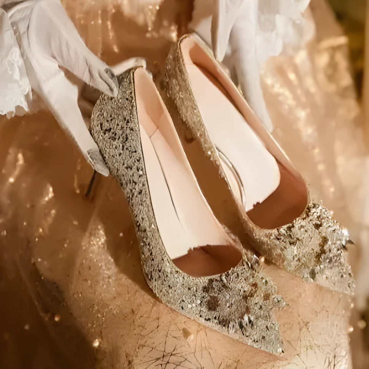 Champagne coloured women's wedding high heel shoes with crystal decoration and a pointed toe.