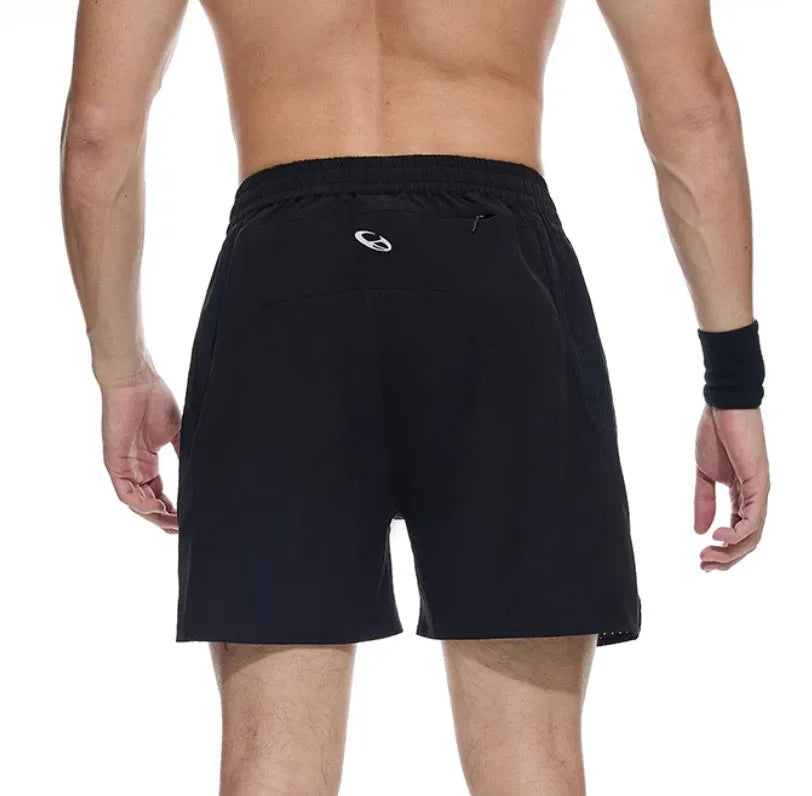 Men's black four-point stretch running shorts with laser-stitched seams on a grey background.