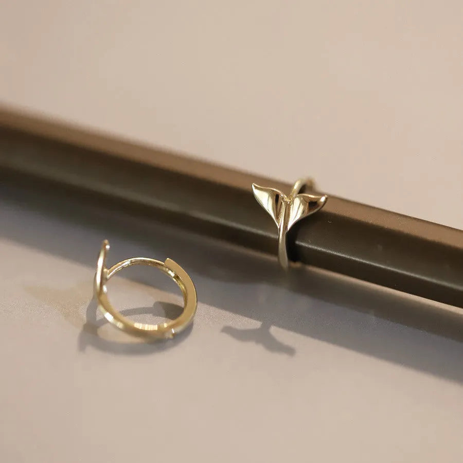 Pair of S925 sterling silver earrings with 14k gold plating featuring a smooth fishtail design and 8mm inner diameter