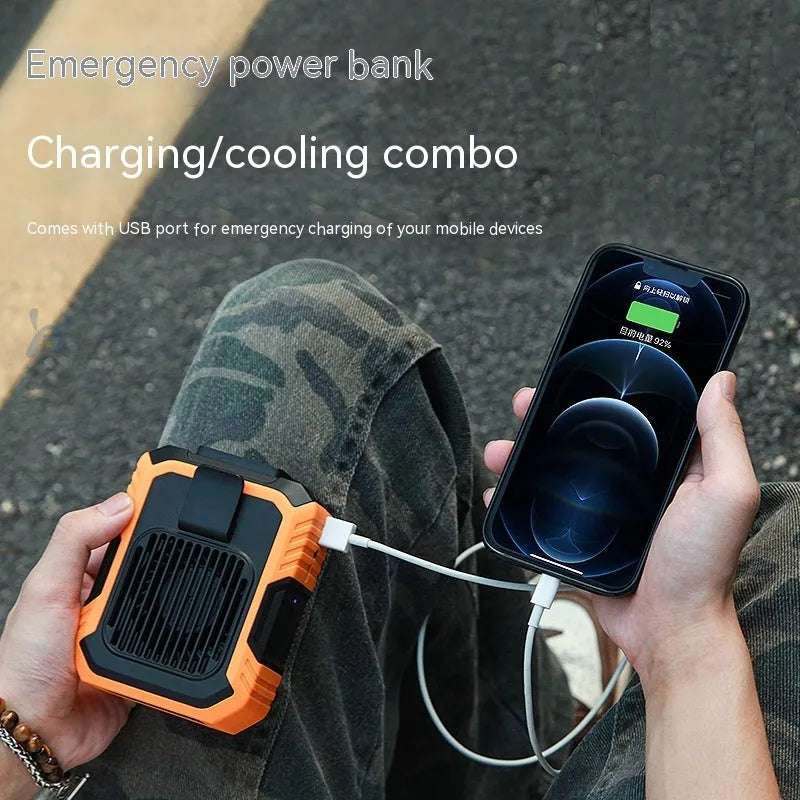 Green wrist hanging personal fan with USB power bank and LED light on a person's arm.