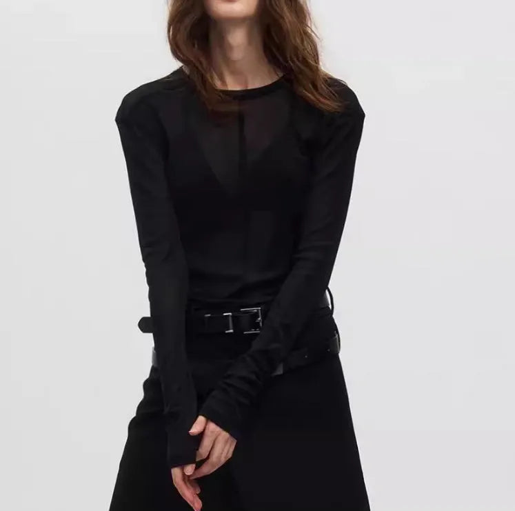 Black mesh see-through slim-fit long sleeve pullover top with round collar on a mannequin.