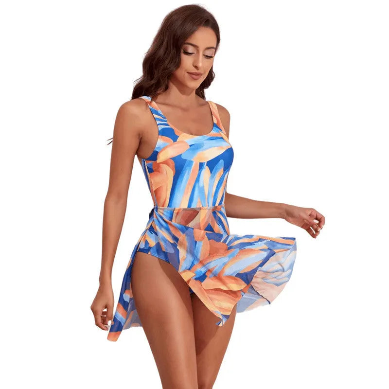 Women's one-piece swimsuit with colourful floral digital print and single-shoulder design.