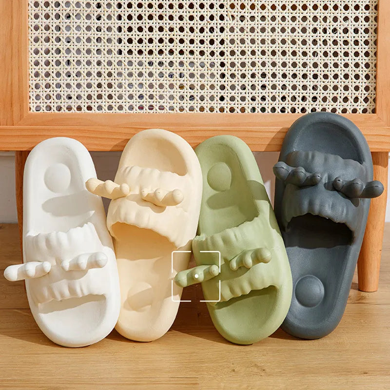 Pair of light-coloured EVA flip flop slippers with hollow-out design and textured sole.