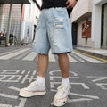 Light blue distressed denim shorts with ripped details, shown in a loose, straight-leg hip-hop style fit.
