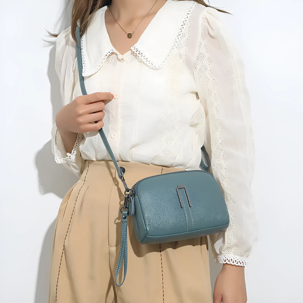 Genuine leather women's square shoulder bag in black, shown with dimensions 19x13x6 cm.