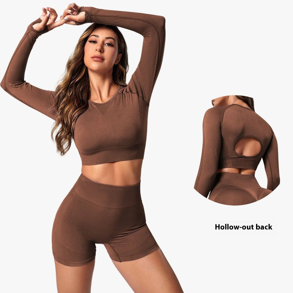 Women's black high-waist yoga suit with long sleeve top and tight-fit pants laid flat.