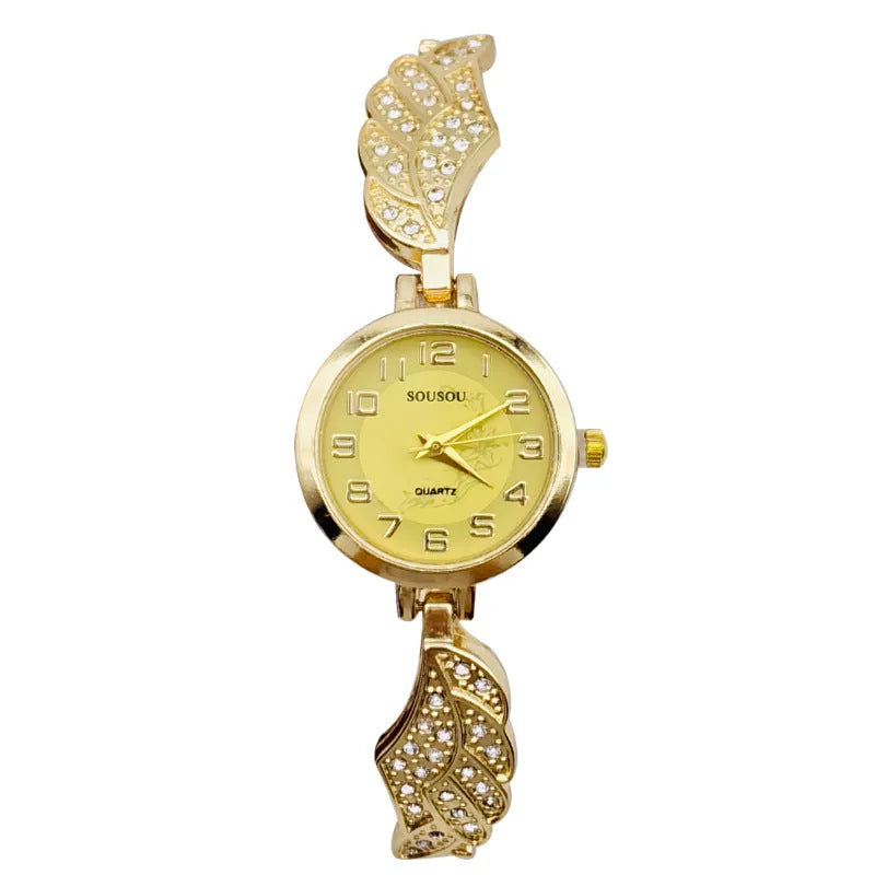 Stainless steel women's watch with round dial and Vachette clasp buckle on wrist.