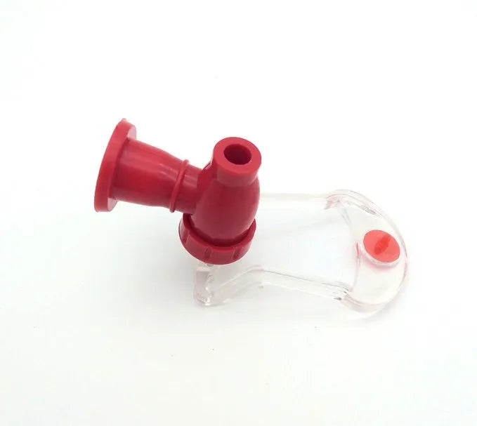 Red plastic Magic Tap soda bottle dispenser attached to a 2-litre bottle.