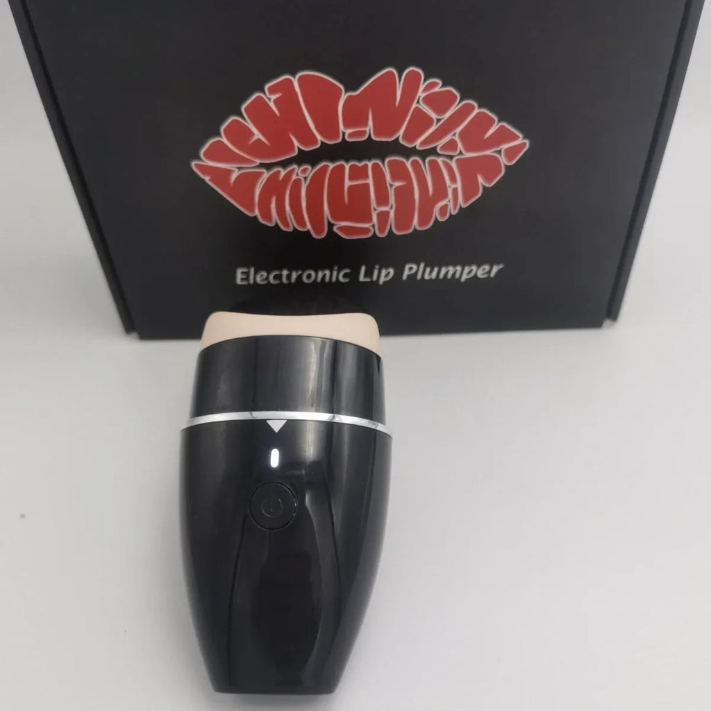 Black and white electric lip plumper device with silicone tip and 3 speed buttons
