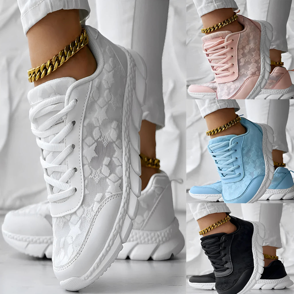 Women's casual canvas running shoes in white, shown from the side on a plain background.