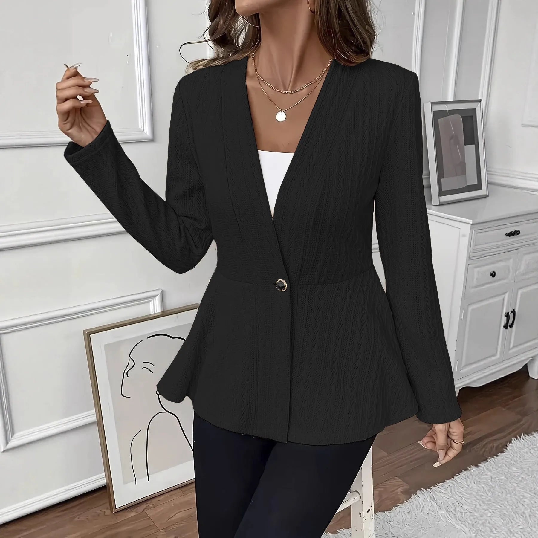Women's apricot coloured knitted cardigan with single button front and jacquard pattern detail