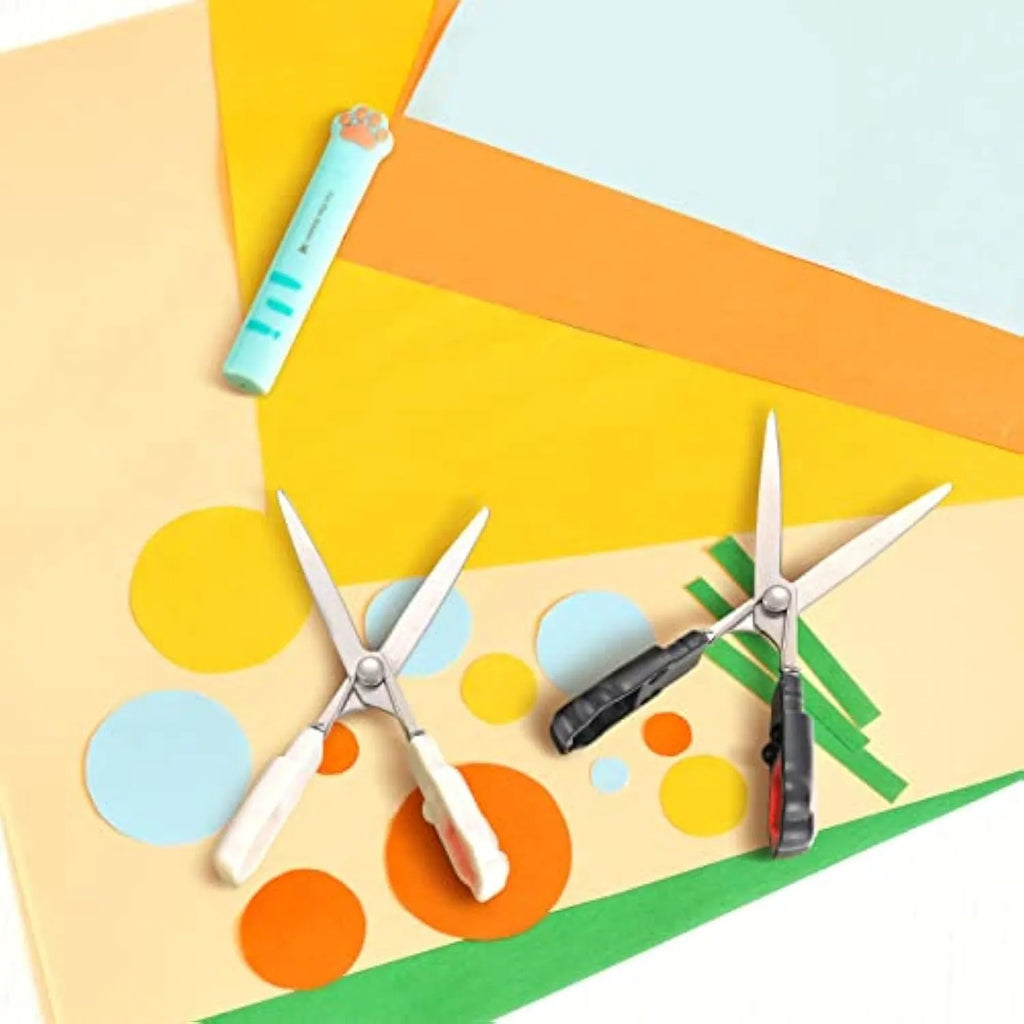 Closed and open views of cute cat paw design mini folding scissors in various colours.