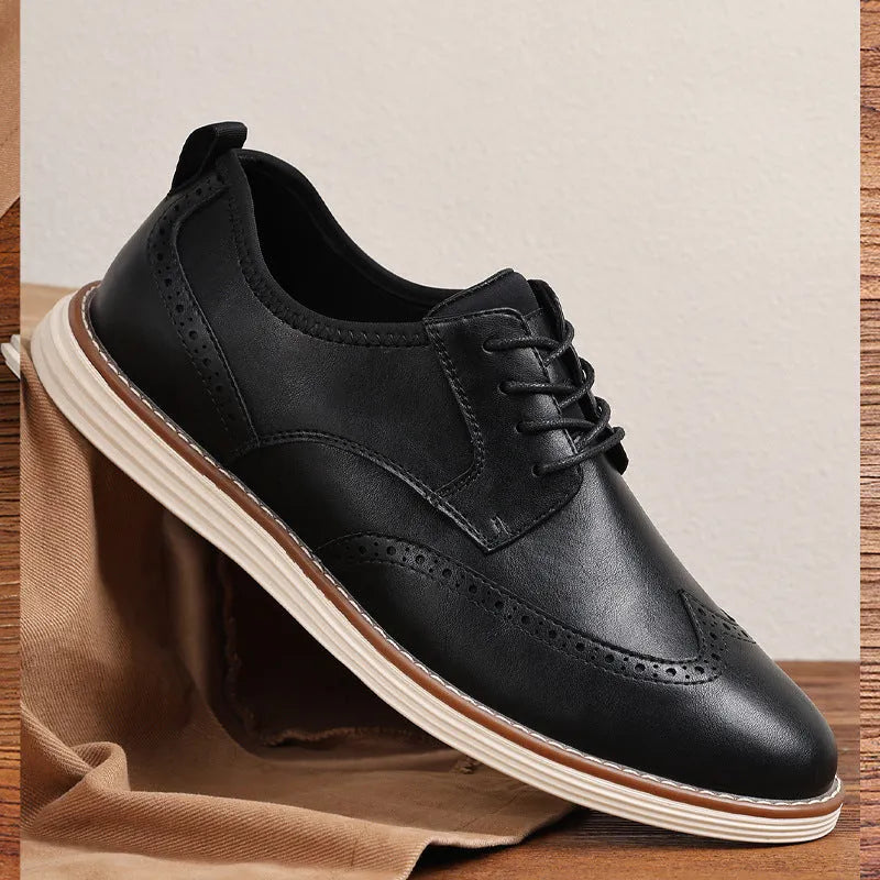 Men's black and brown slip-on business casual shoes with round toe and carved detailing