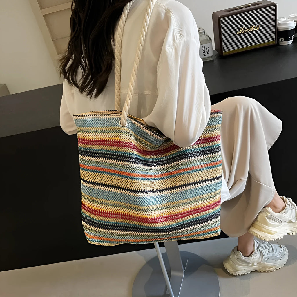 Blue woven shoulder bag with straw-effect pattern, large capacity design with single shoulder strap
