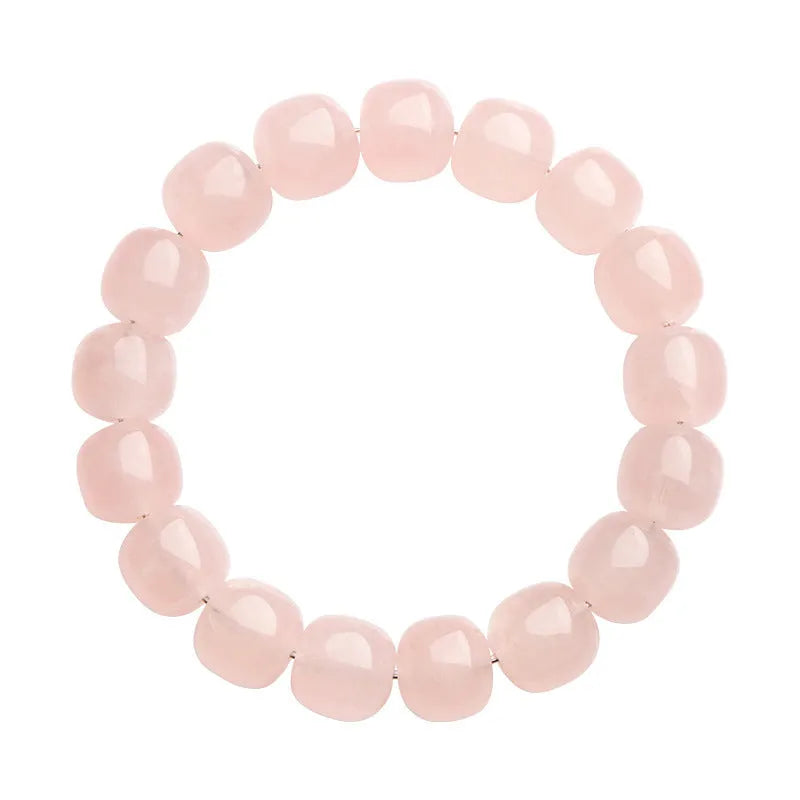 Pink crystal geometric barrel bead bracelet with 11-12mm beads on a wrist.
