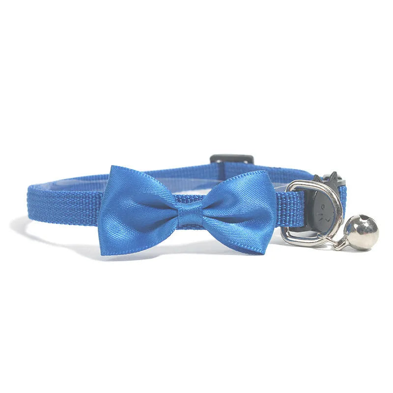 Adjustable striped nylon cat collar with bell in various colors including red, green, and blue