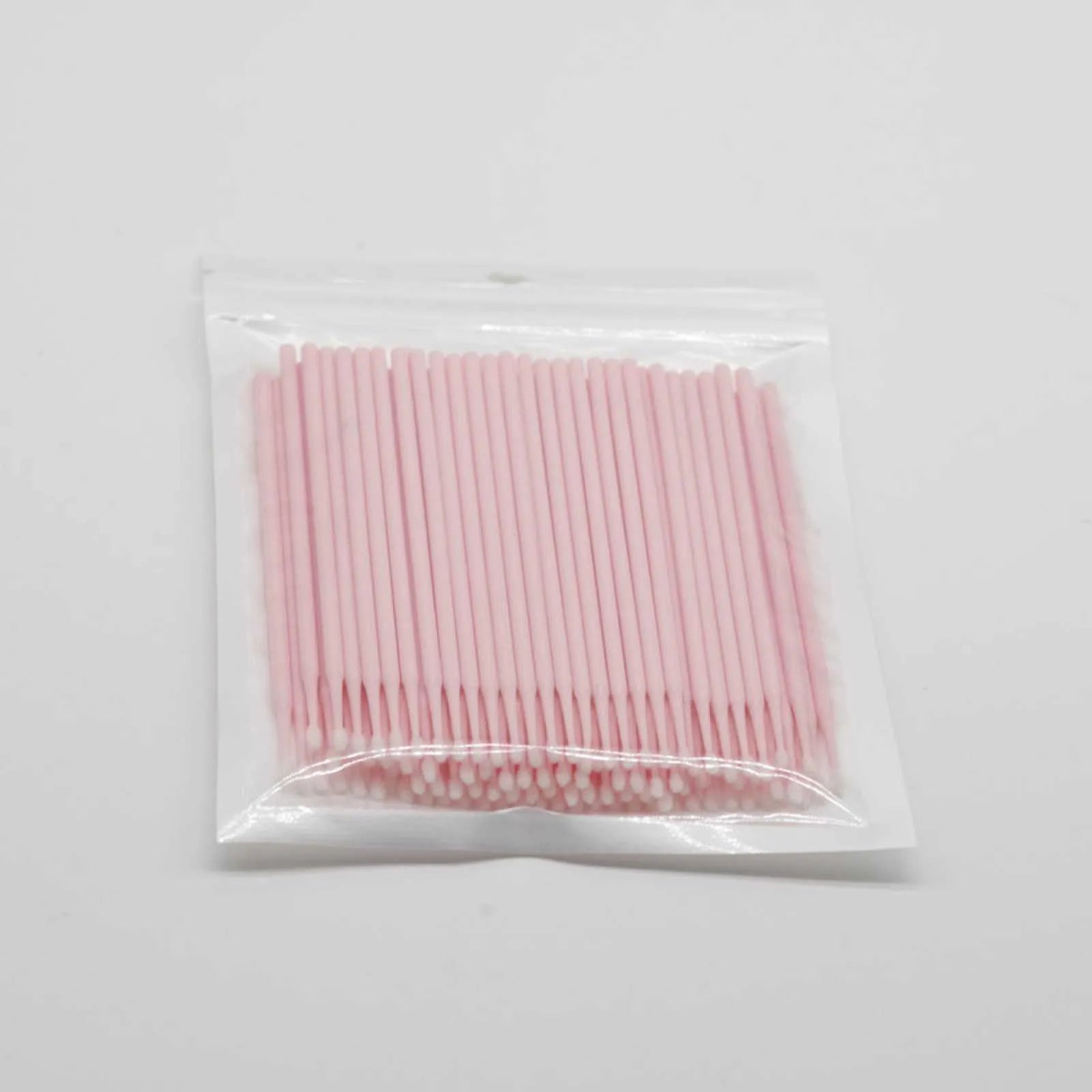 Disposable micro applicator brushes with bendable cotton tips and colour-coded handles for eyelash extensions