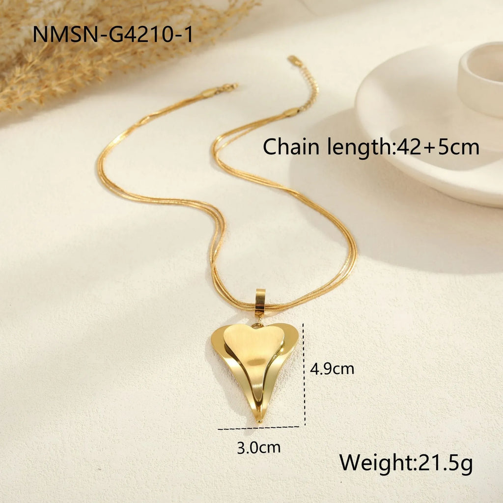 Women's stainless steel necklace with double heart geometric pendant featuring snake bones design in gold plating